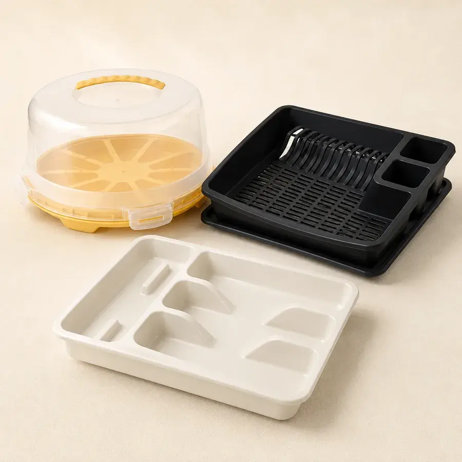 Cake carrier with dome lid, black dish drainer and cutlery drawer organiser
